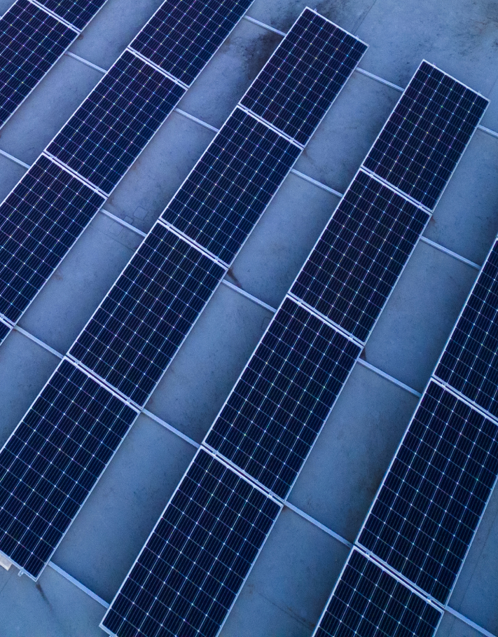Industrial solar panels installed in rows on a commercial rooftop